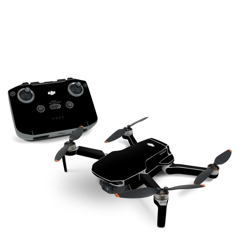 DJI Mini 2 Skin design of Black, Darkness, White, Sky, Light, Red, Text, Brown, Font, Atmosphere, with black colors