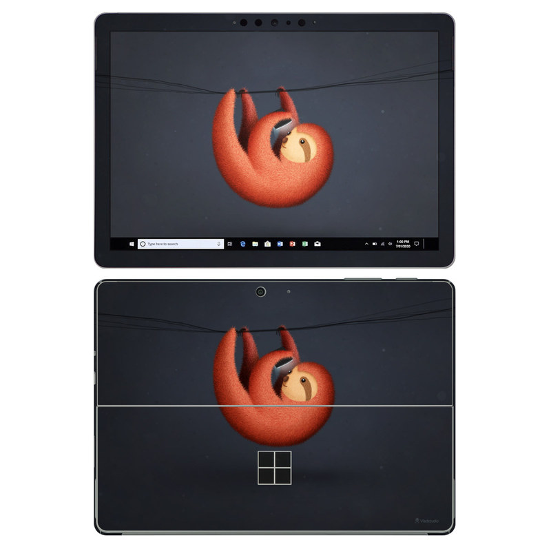 Microsoft Surface Go 2 Skin design of Orange, Still life photography, Logo, Graphics with black, orange, brown, gray colors